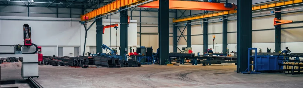 Industrial workshop with fabrication bays and overhead cranes